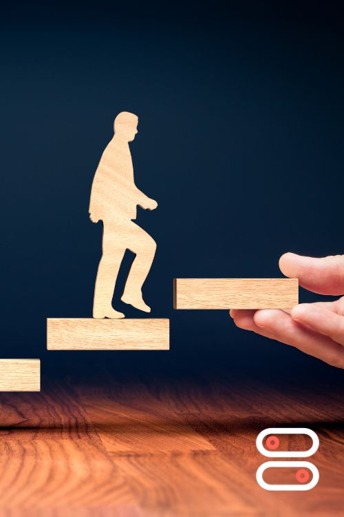 man climbing stairs which are supported by hand