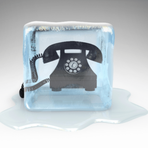Old fashioned telephone in block of ice