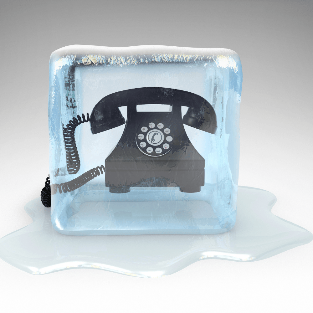 Old fashioned telephone in block of ice